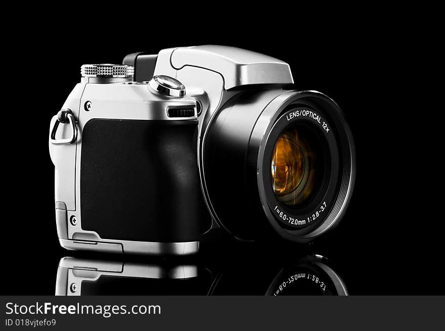 Close-up photo camera isolated on black