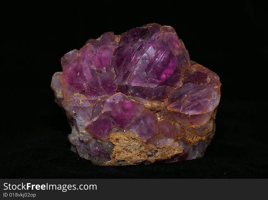 Natural amethyst crystallized structure on black background