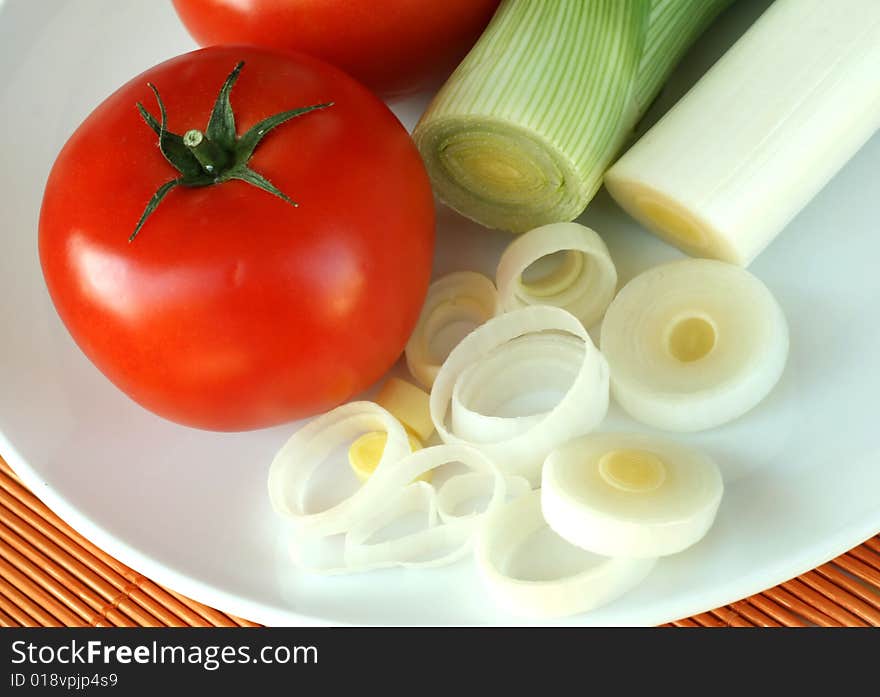 Tomato and leek on a plate