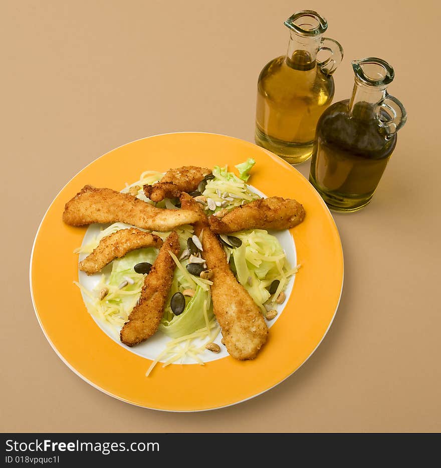 Salad with turkey stripes