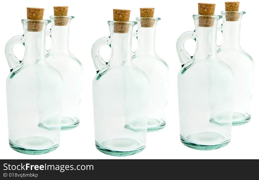 Bottle made of glass with corks, against a white background isolates