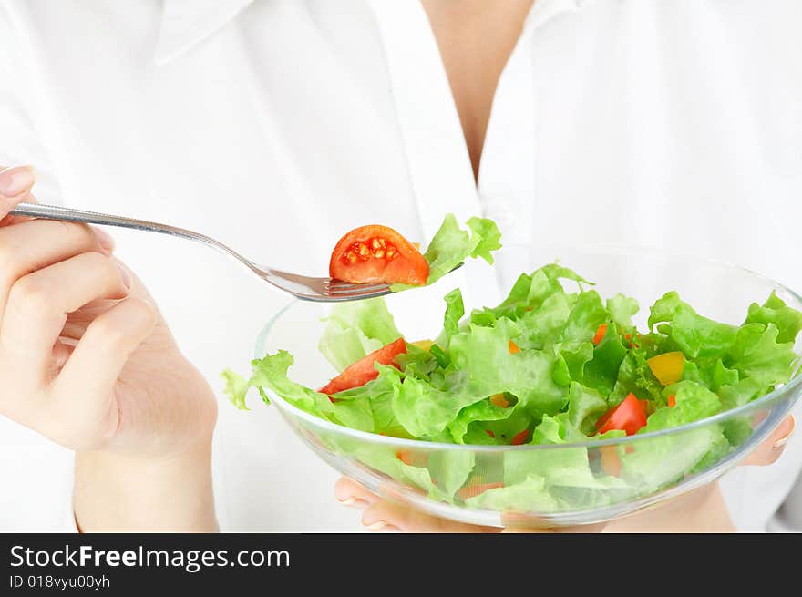 Close up of a plate with salad in hands. Close up of a plate with salad in hands