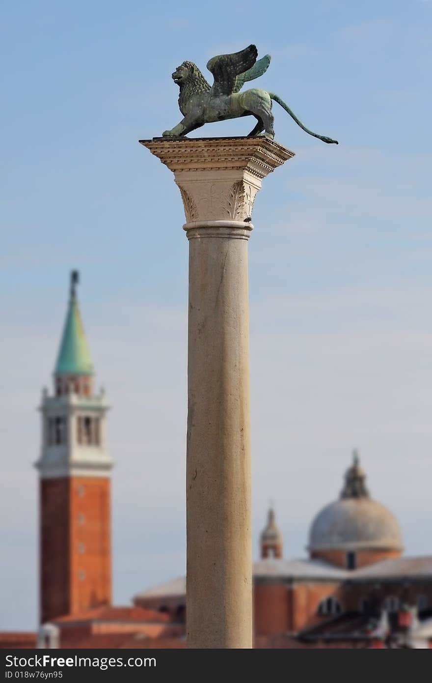 Column with lion-symbol of Venice in front of San Giorgio Maggiore church in Venice, Italy. Column with lion-symbol of Venice in front of San Giorgio Maggiore church in Venice, Italy.