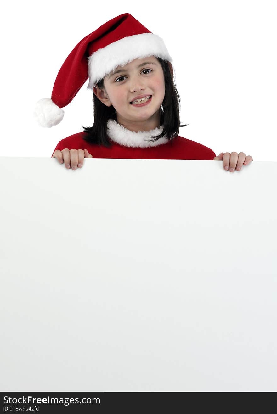 Little girl with santa clothes holding a white banner isolated on white. Little girl with santa clothes holding a white banner isolated on white