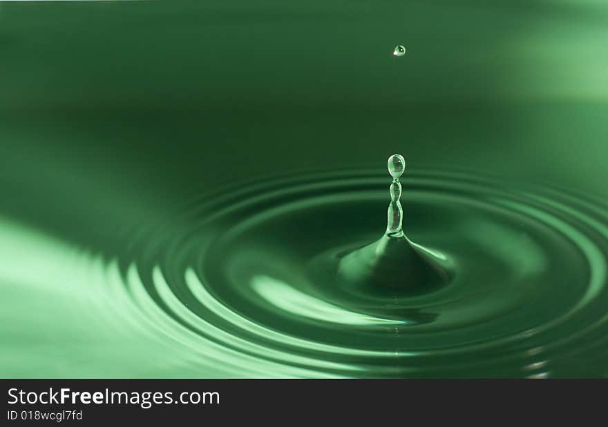 Water droplets close up in green. Water droplets close up in green