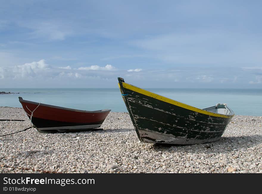 Small boats lying on the beach in Yport, France. Small boats lying on the beach in Yport, France