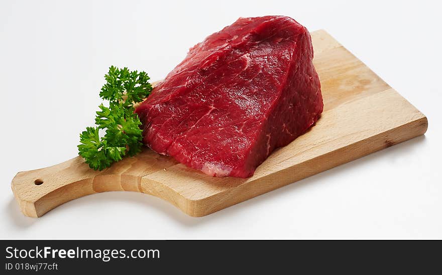 Piece of beef on wooden desk