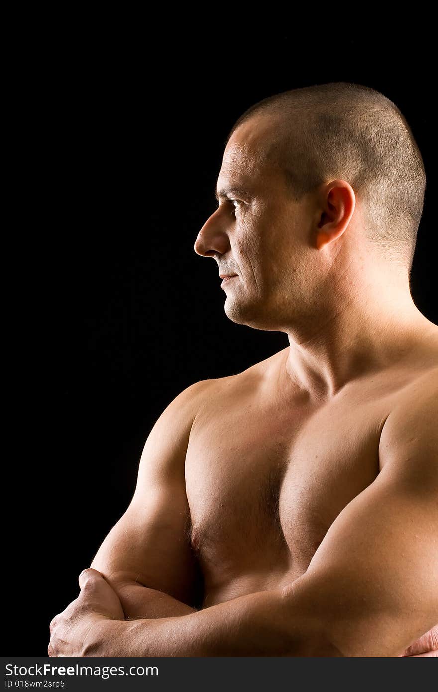 Muscular man isolated on black