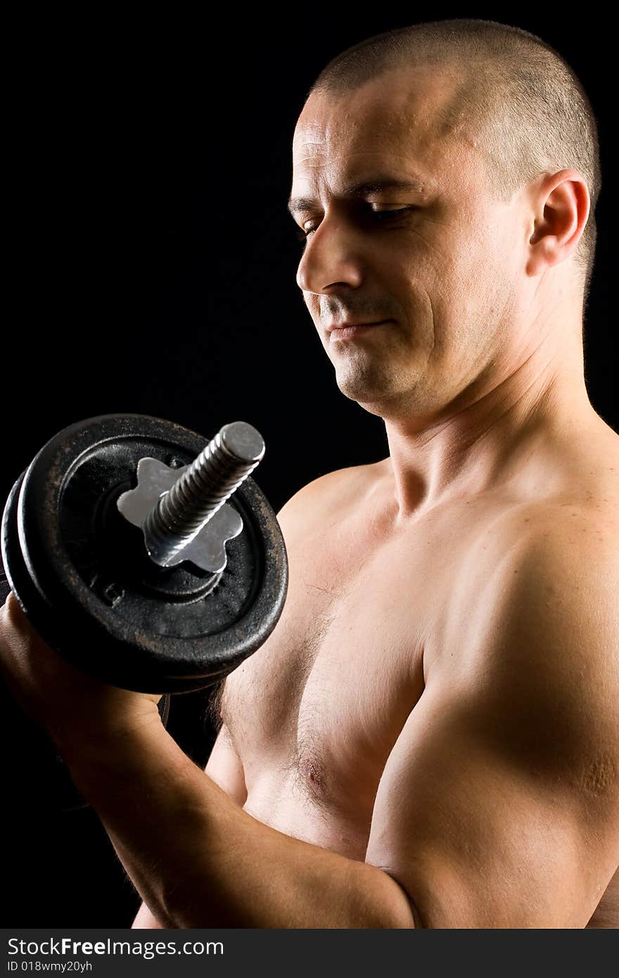 Man Lifting Weights Isolated On Black