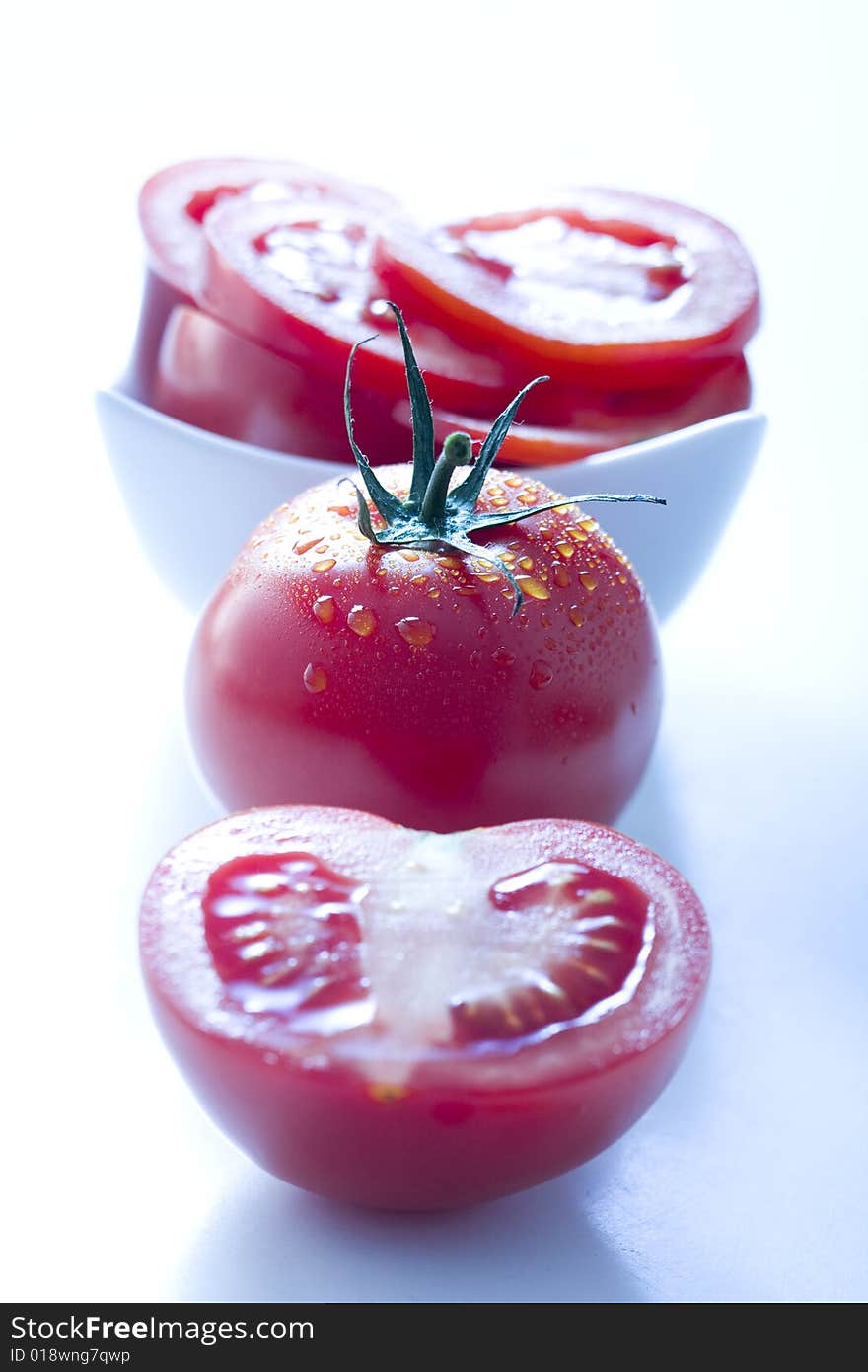 Fresh tomatoes on white background