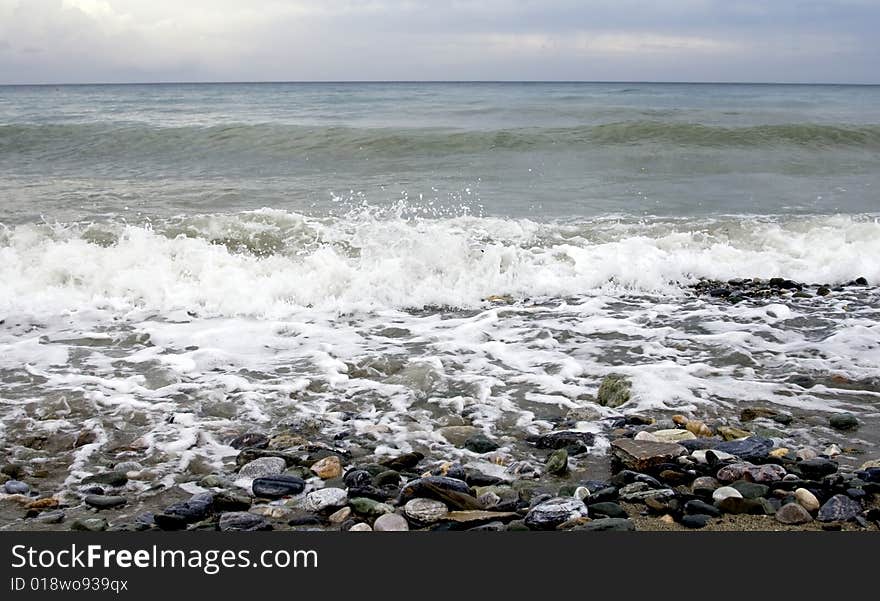 Seashore with waves and rocks