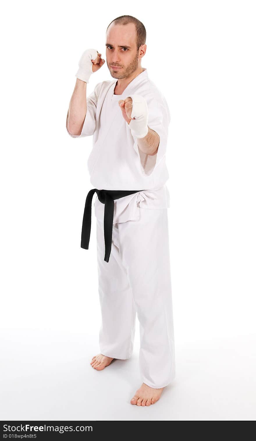 White man doing martial arts on isolated background