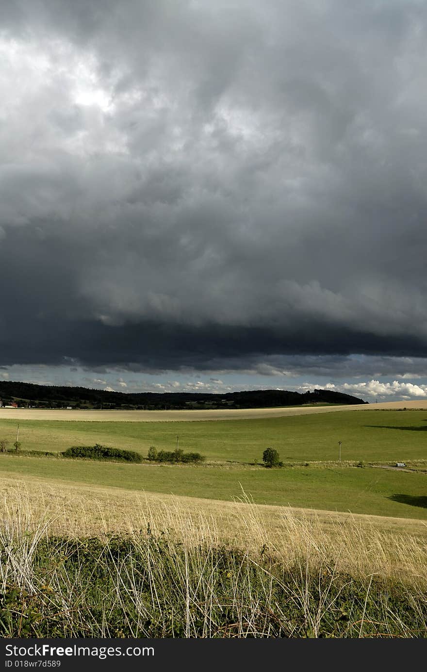 Summer landscape and heavy clouds