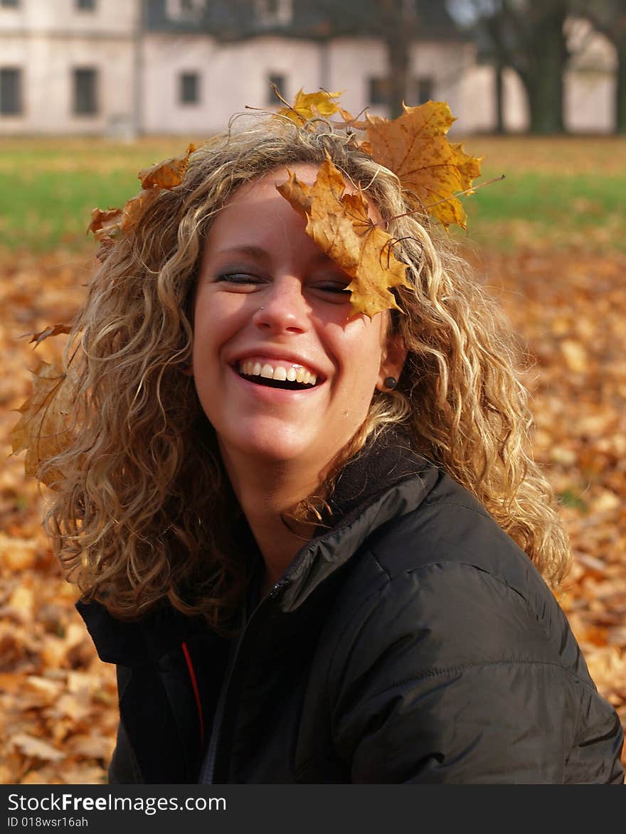 Happy girl in autumn park