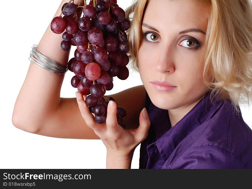 Woman with bunch of grapes