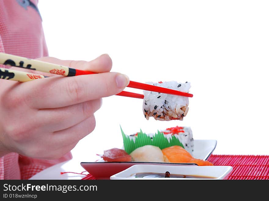 Set of rolls and sushi on several plates. Set of rolls and sushi on several plates