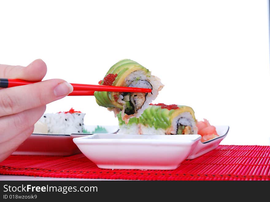 Set of rolls and sushi on several plates. Set of rolls and sushi on several plates