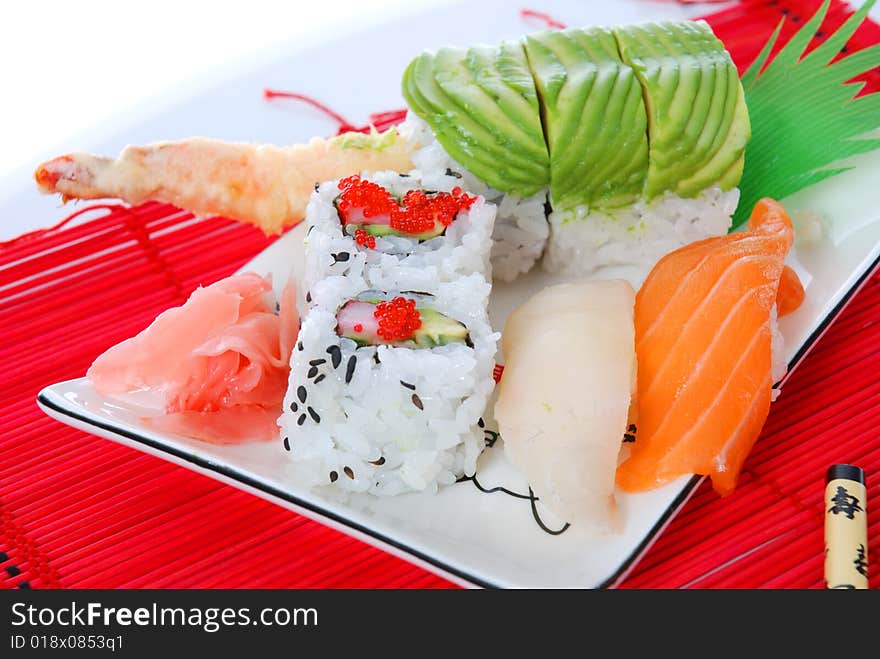 Set of rolls and sushi on several plates. Set of rolls and sushi on several plates