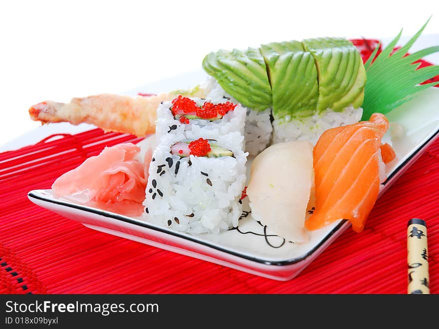 Set of rolls and sushi on several plates. Set of rolls and sushi on several plates