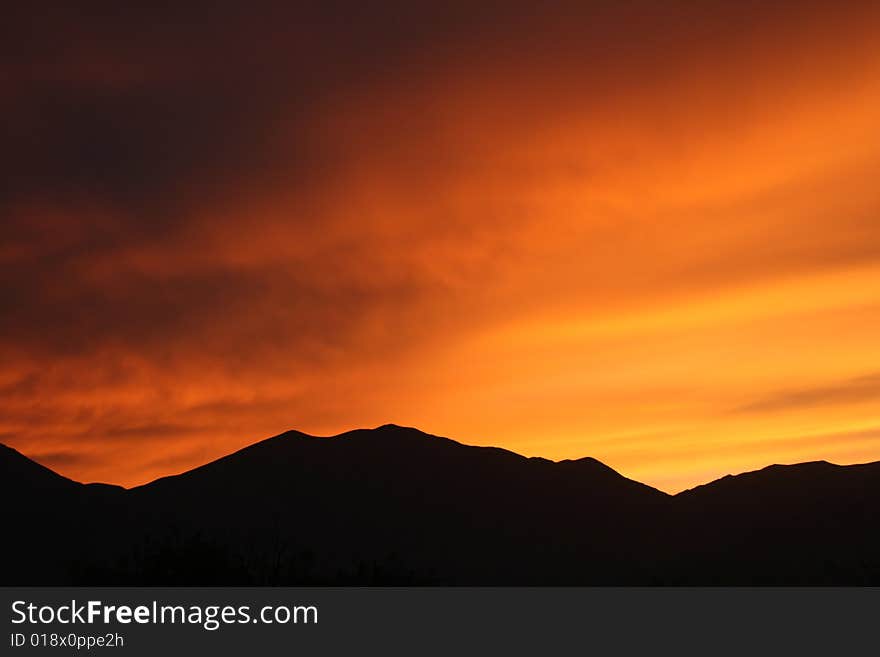 The sun setting behind the Panamint Mountains. The sun setting behind the Panamint Mountains