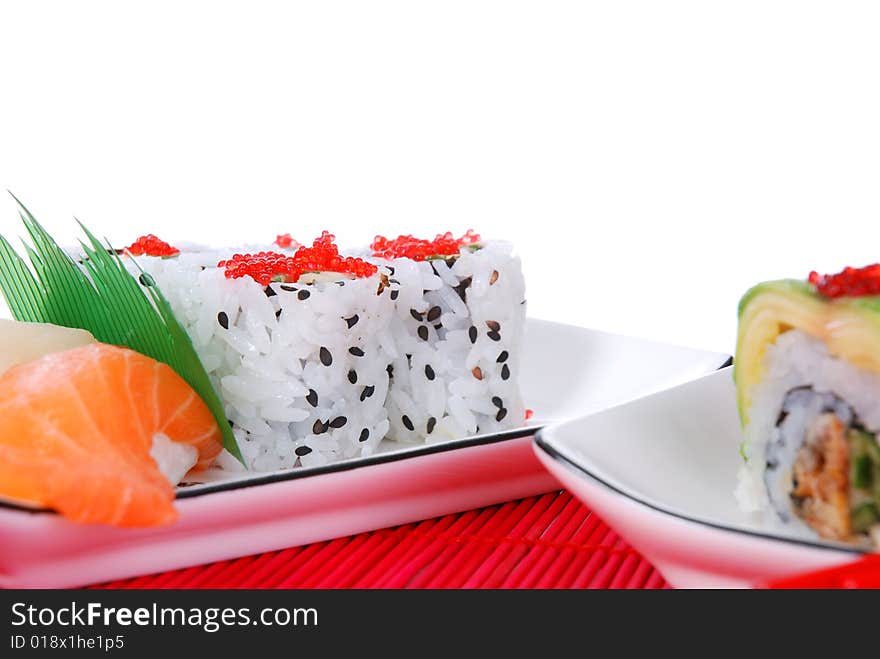 Set of rolls and sushi on several plates. Set of rolls and sushi on several plates