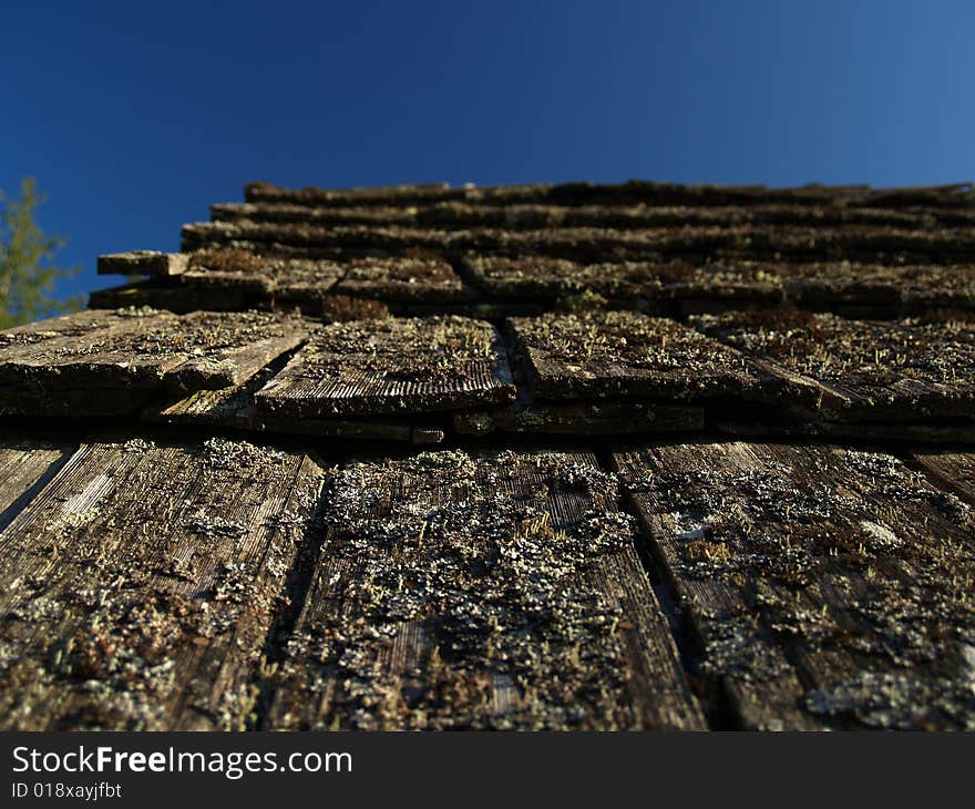 The shingle roofing of a barn. The shingle roofing of a barn.