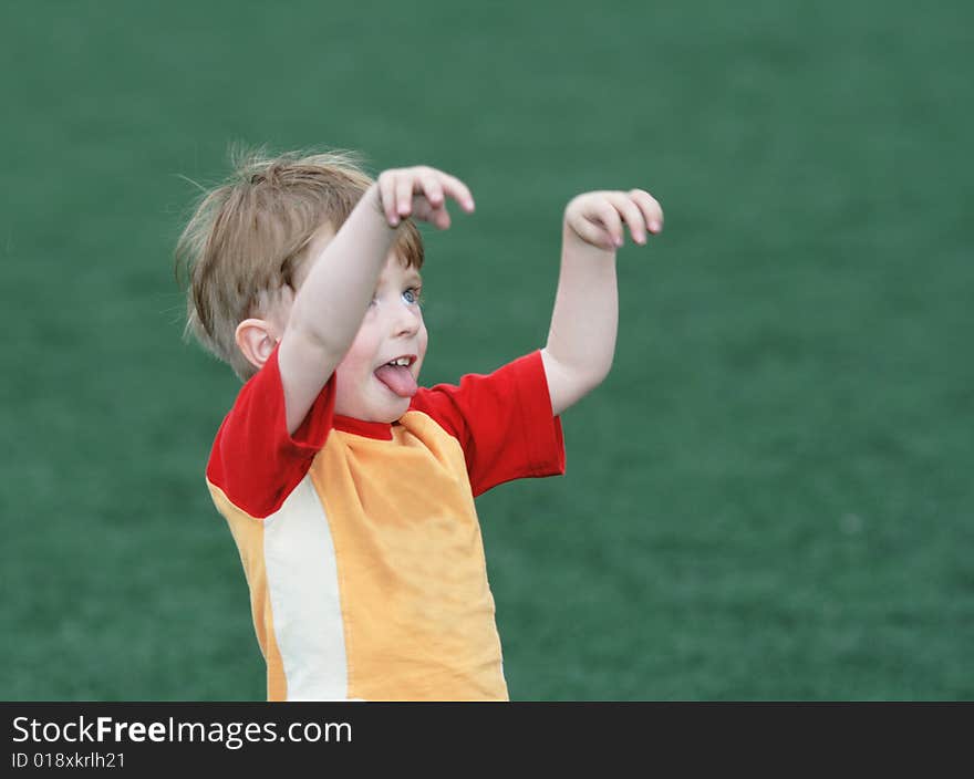 Portrait of the boy on a green field. Portrait of the boy on a green field