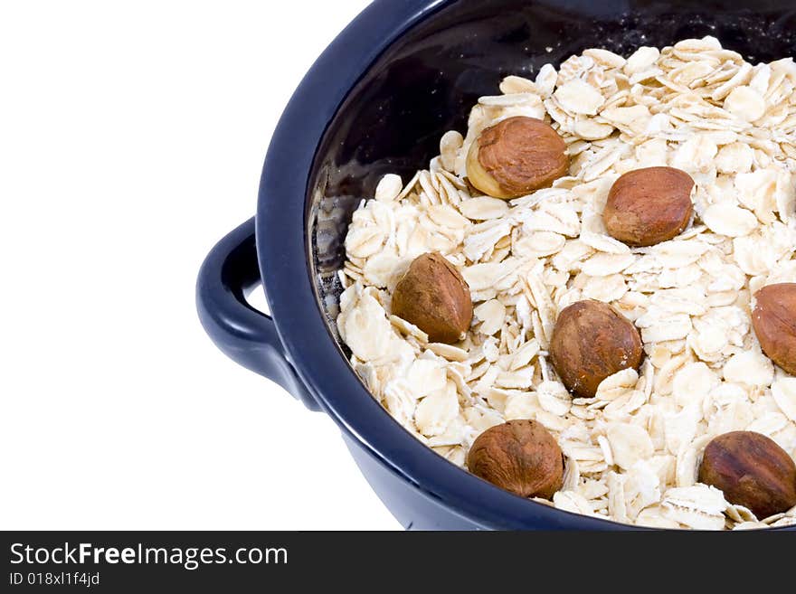 A bowl of oatmeal with hazelnuts - healthy diet