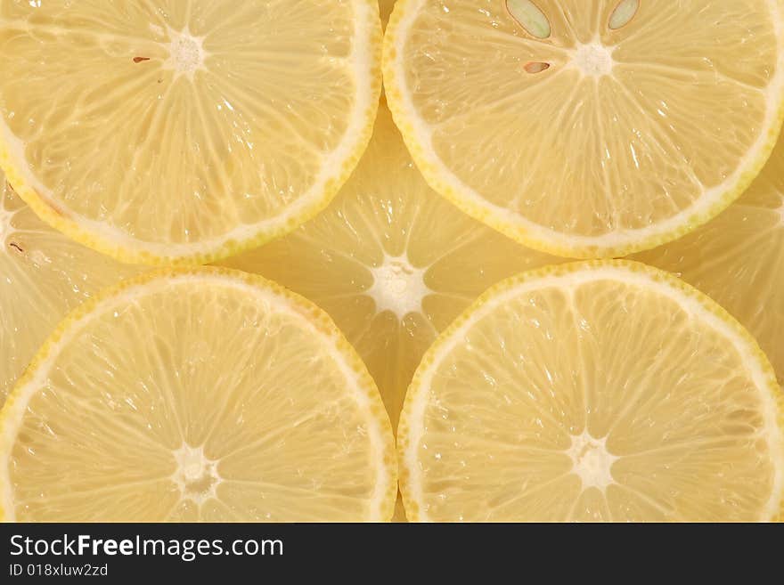 Slices of yellow lemon in macro view