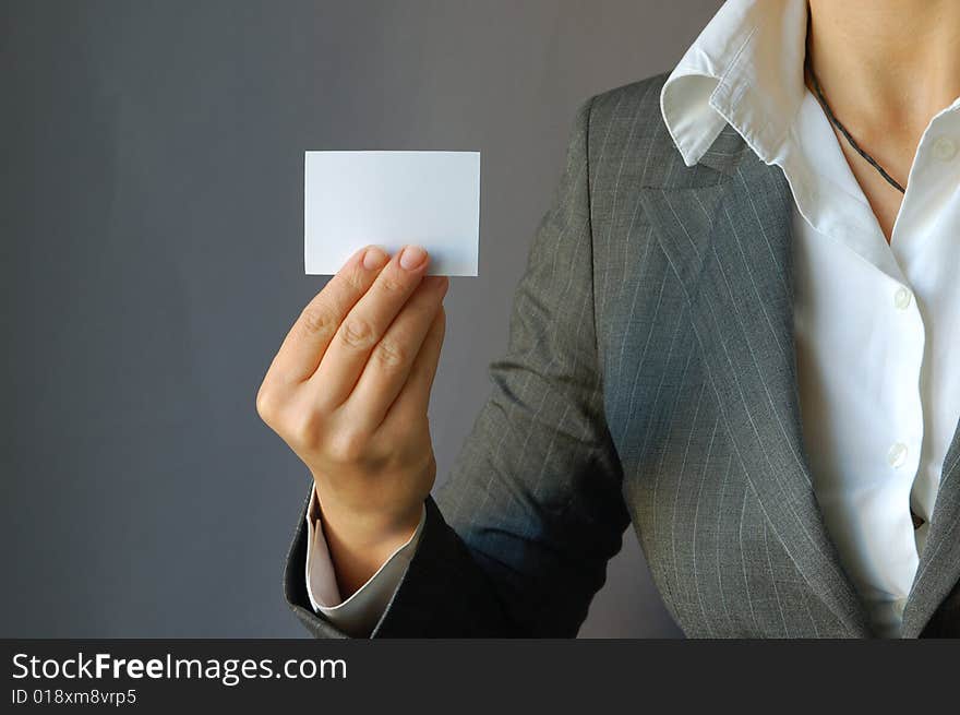 The young businesswoman hold the card in the hand