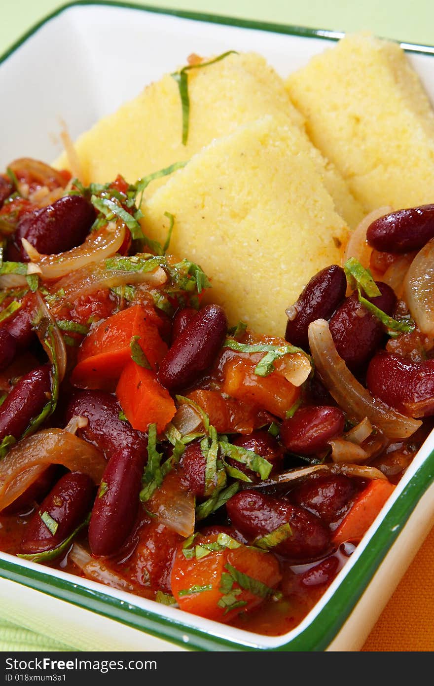 Polenta with stewed vegetable in bowl