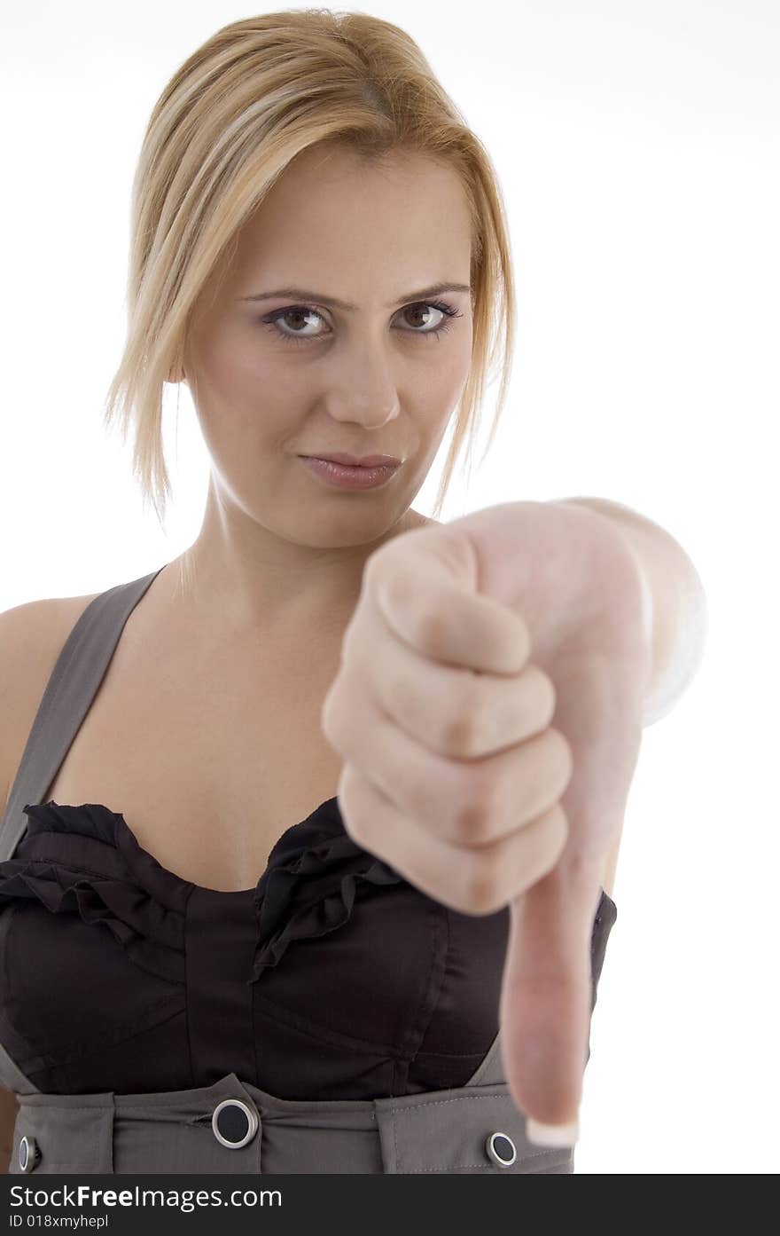 Woman showing thumbs down gesture on an isolated background