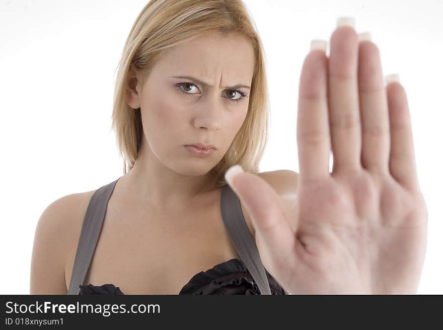 Angry woman showing stopping gesture on an isolated white background