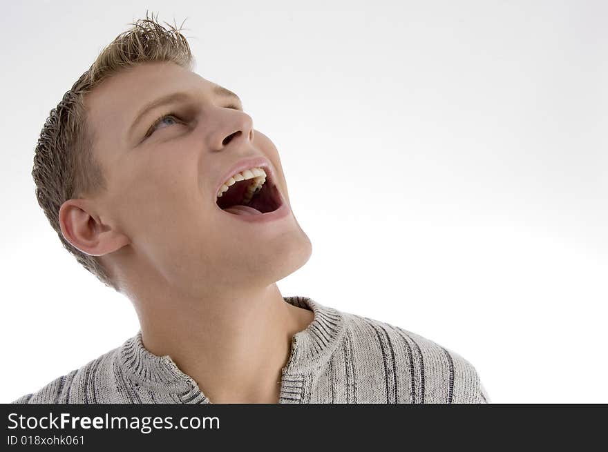 Laughing young man against white background