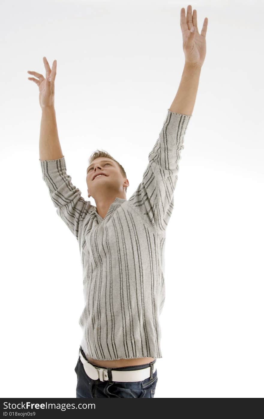 Smiling man stretching his arms on an isolated white background