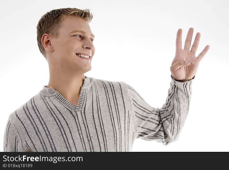 Smiling man with counting hand gesture on an isolated white background