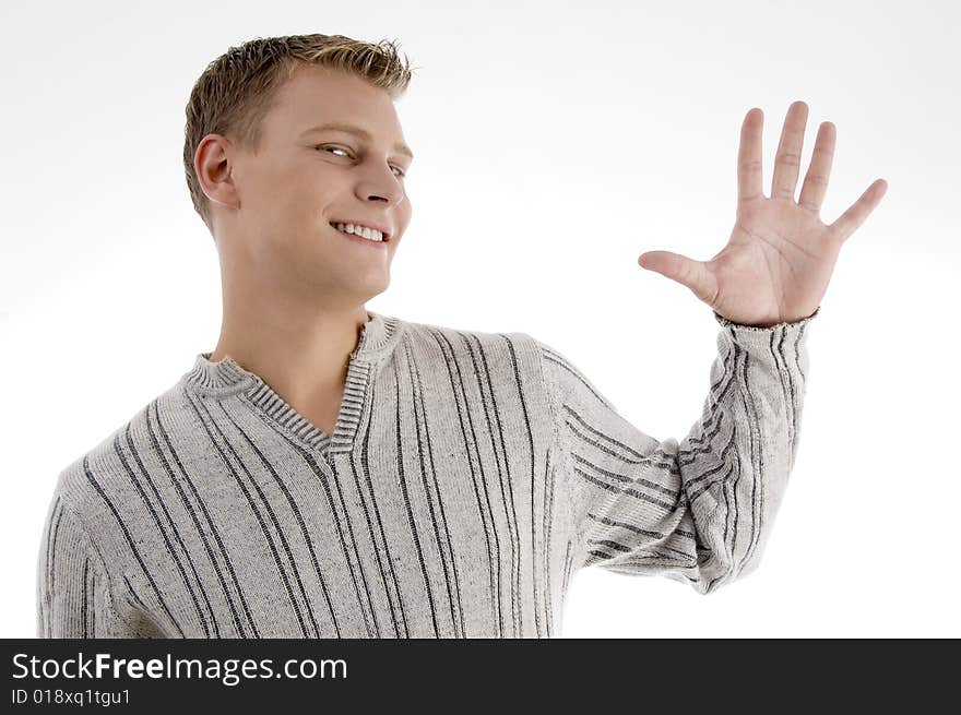 Young man with counting hand gesture on an isolated background