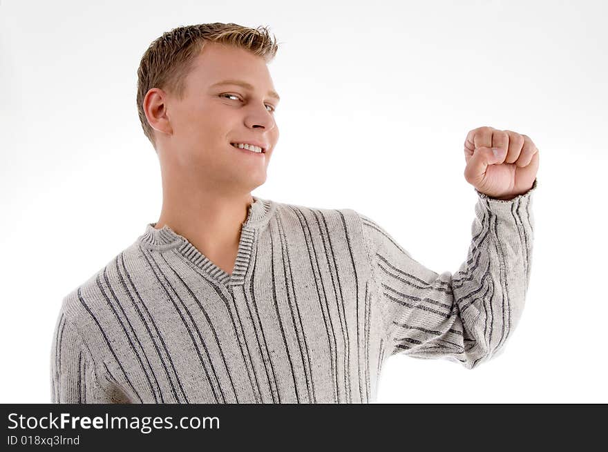 Smiling man showing his fist with white background