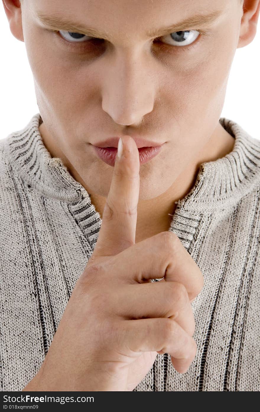 Close up of man instructing you to be silent on an isolated white background