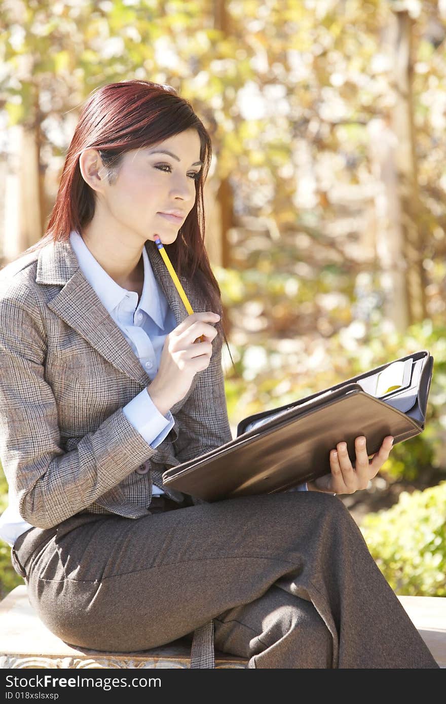 A business woman thinking out of the office