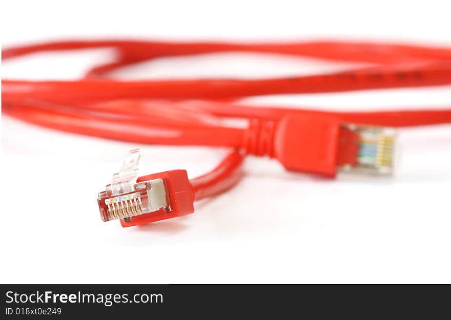 Red computer network cable on white background