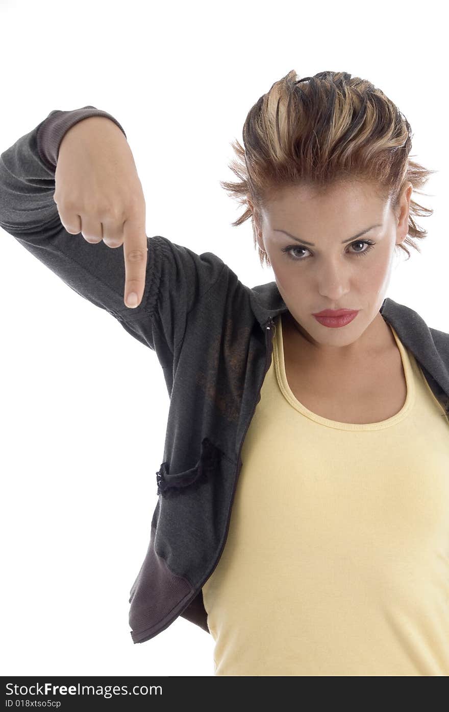 Young female pointing down on an isolated background