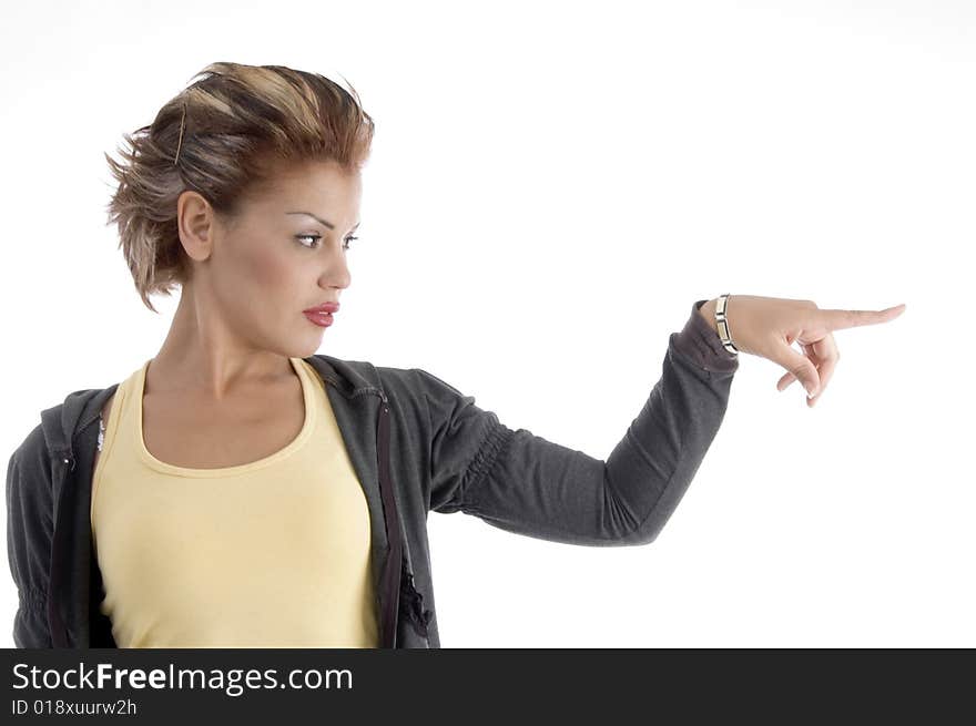 Attractive woman indicating side against white background