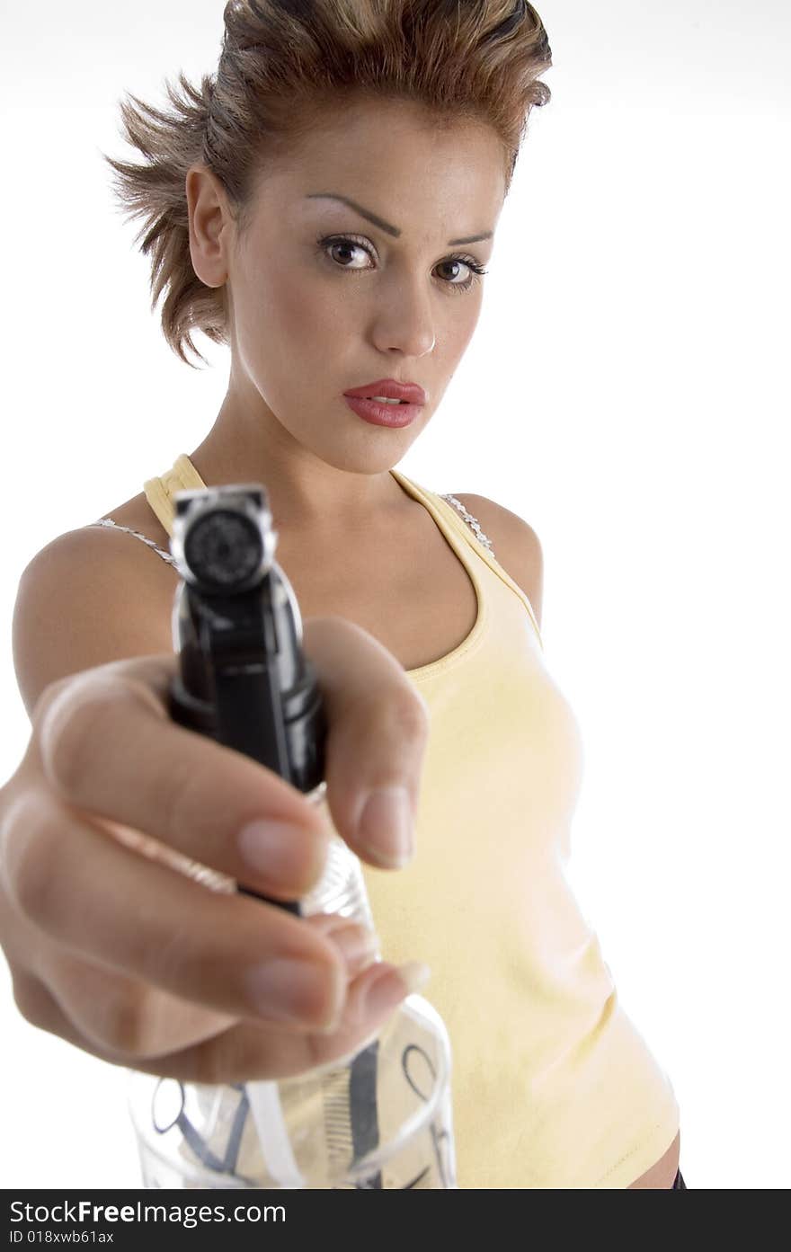 Woman posing with spray bottle against white background