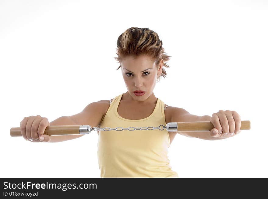 Woman with nunhaku with white background. Woman with nunhaku with white background