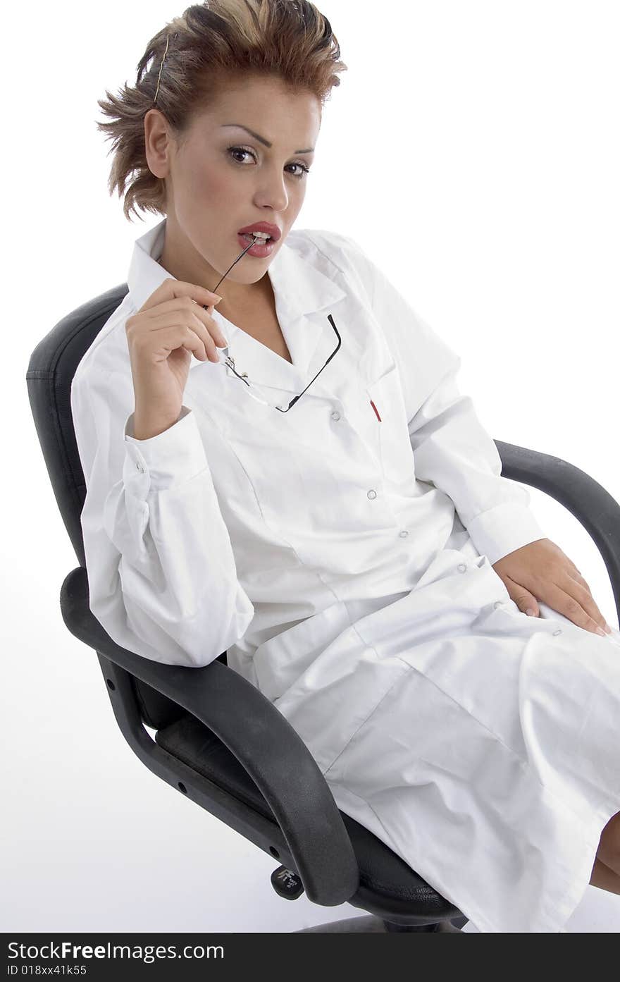 Sitting pretty doctor with eyeglasses on an isolated white background