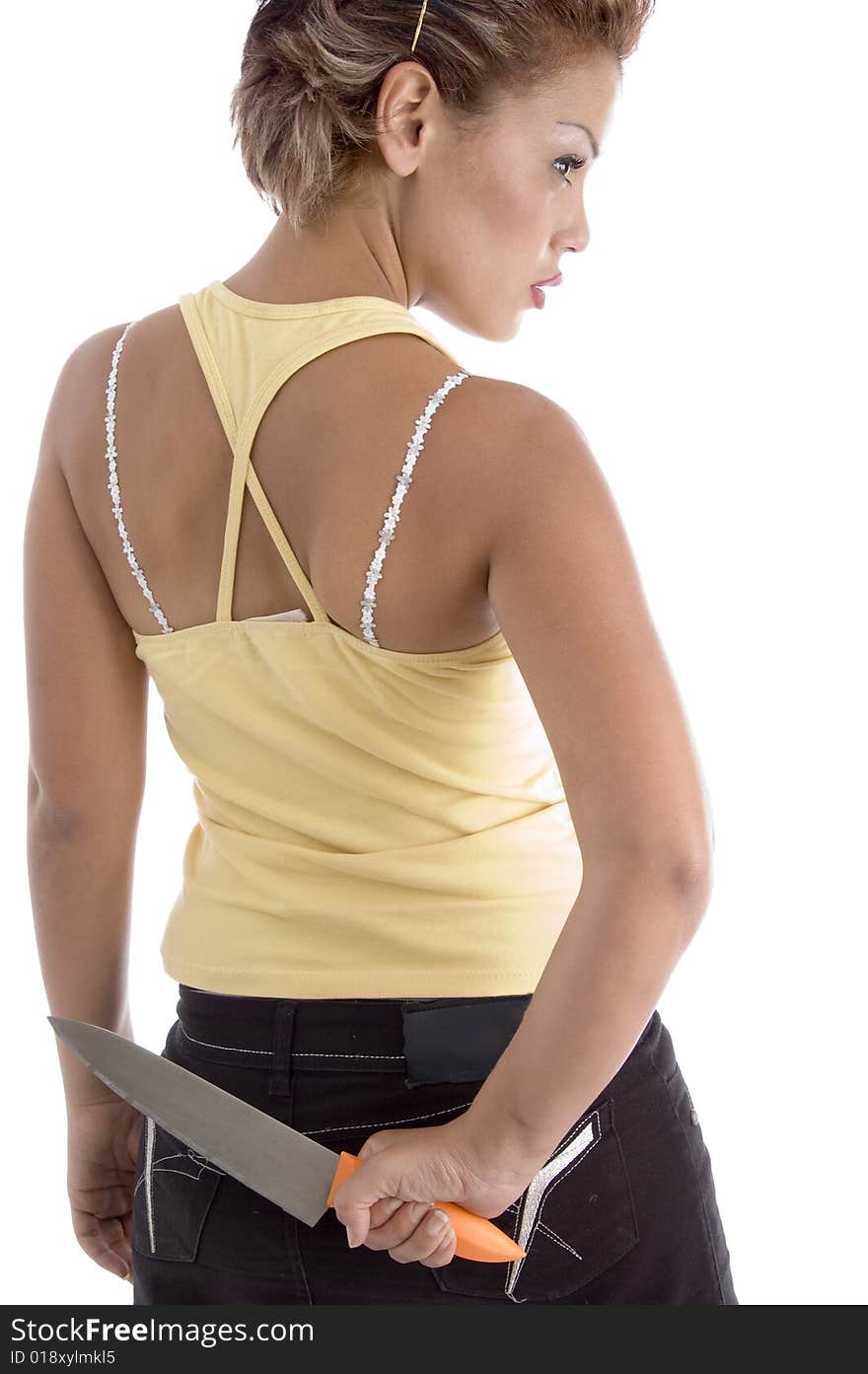 Back pose of woman with knife