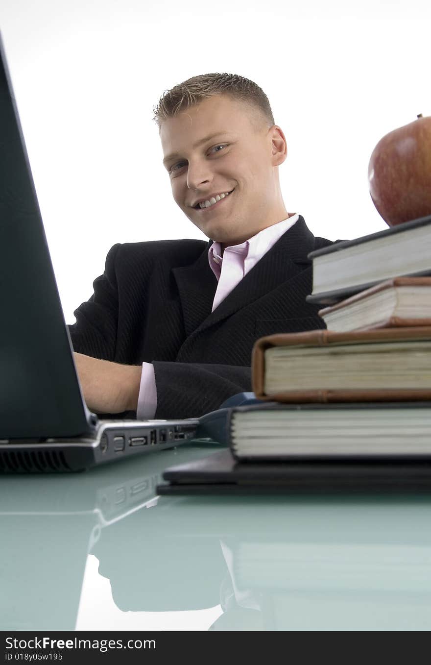 Smiling young executive on an isolated background