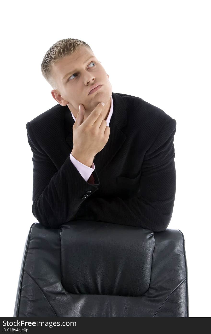 Thinking businessman with chair  against white background