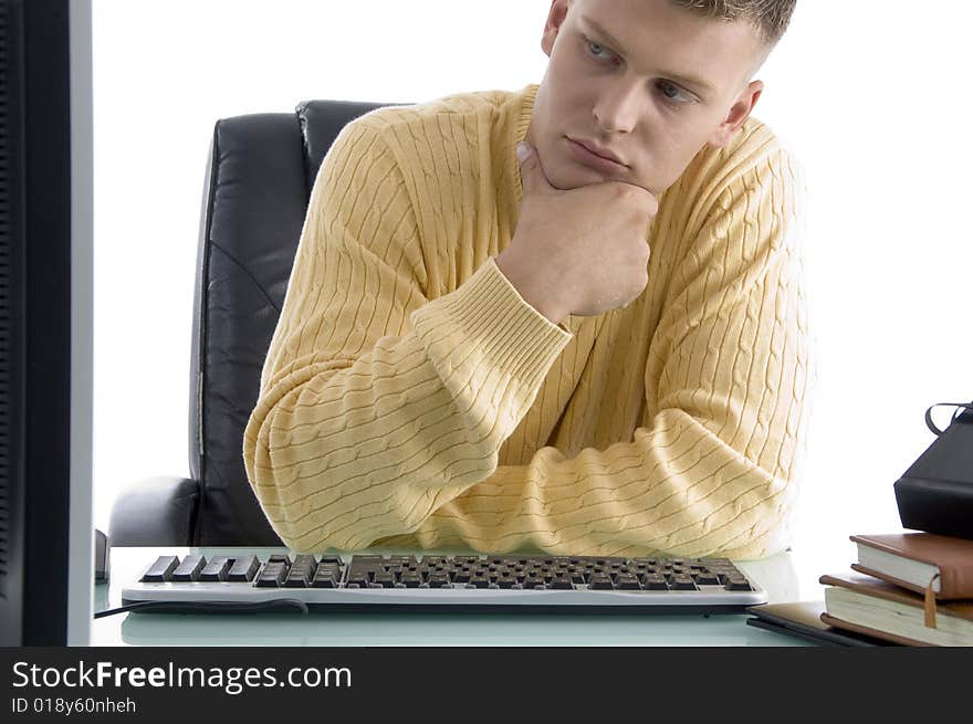 Thinking male while looking on screen on an isolated white background